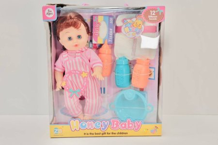 دمية الرضيع "Honey Baby" مع أدوات الرعاية